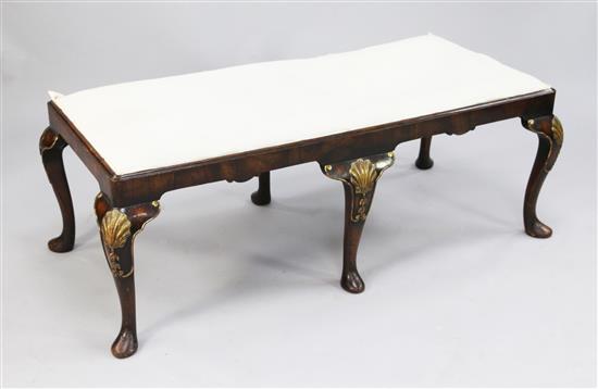 A Queen Anne style walnut and parcel gilt rectangular stool, overall W.4ft 1in.